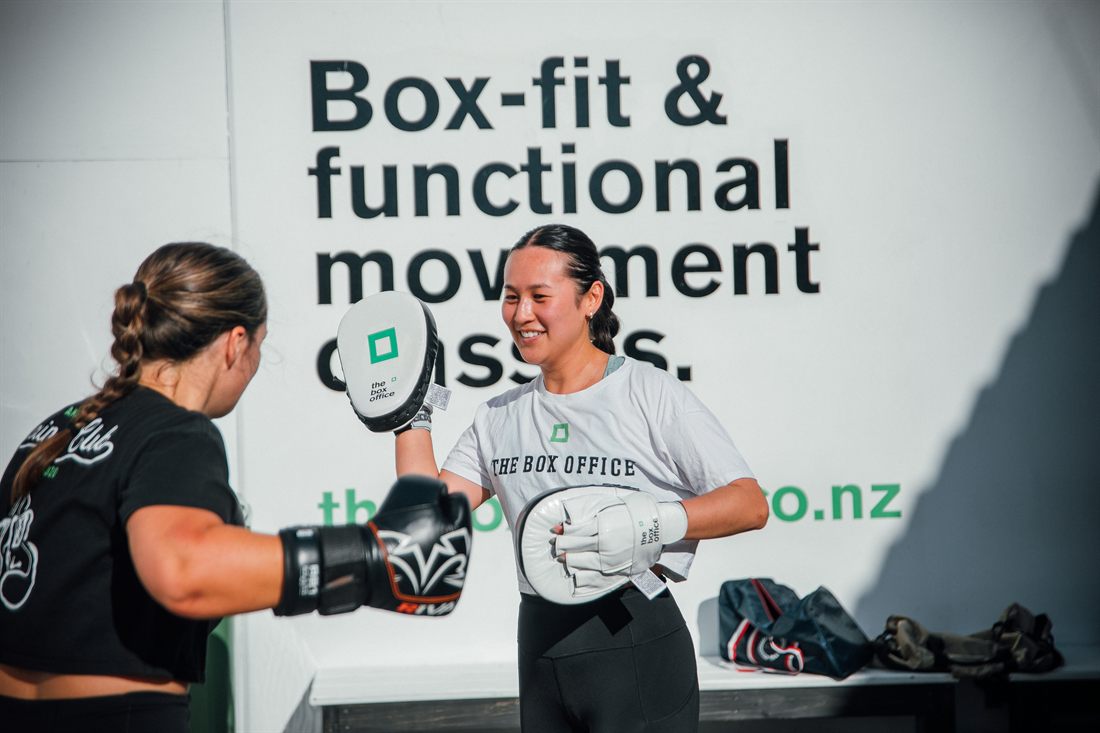 Member doing bag rounds in a BoxFit class